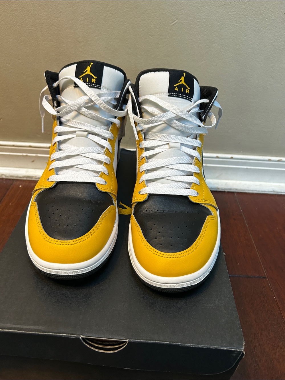 Men’s size 12 Air Jordan 1 mid yellow black and white.